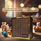 Load image into Gallery viewer, Gold and black money bank with piggy banks and toys on a wooden surface.